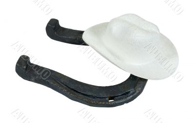 White Cowboy Hat on a Metal Horseshoe