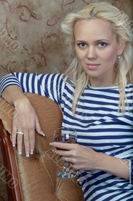 A girl with a glass of wine