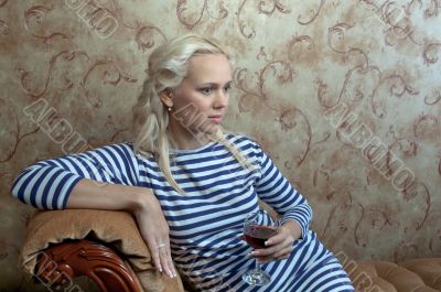 A girl with a glass of wine
