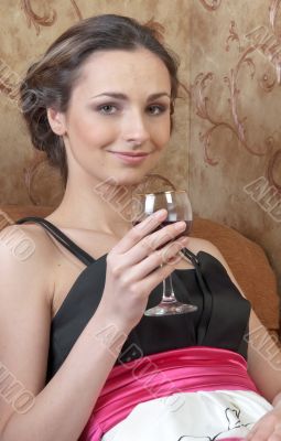 A girl with a glass of wine