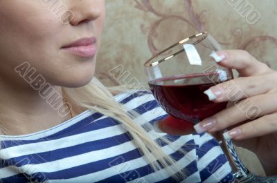 A girl with a glass of wine