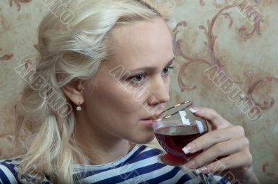 A girl with a glass of wine