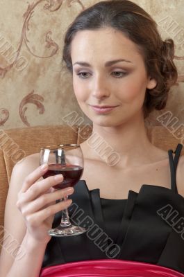 A girl with a glass of wine