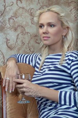 A girl with a glass of wine