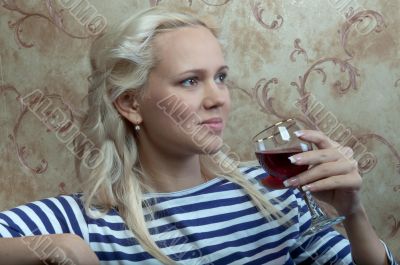A girl with a glass of wine