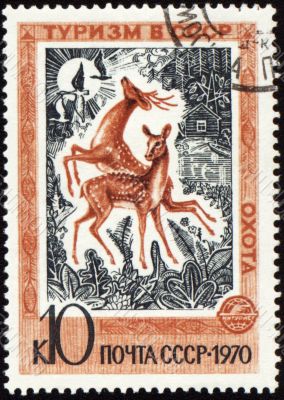 Playing deers on post stamp