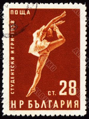 Dancing young woman on post stamp