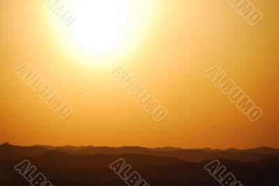 sunset with mountain in the desert
