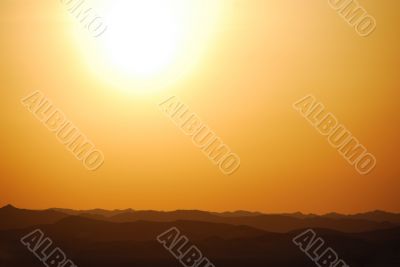 sunset with mountain in the desert