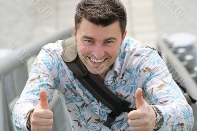 Young man with thumbs up