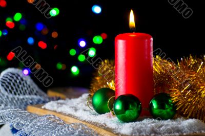 Red candle with a green New Year`s