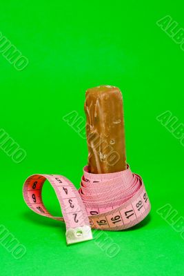 Chocolate bar with a pink metering tape