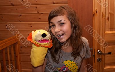 Girl with soft toy on hand