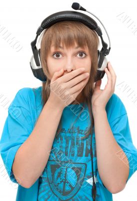Beautiful girl in earphone closes mouth by hand