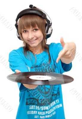 Girl in earphone with vinyl disk in hand