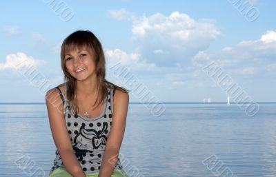 Girl on background sky, sea and sailfish