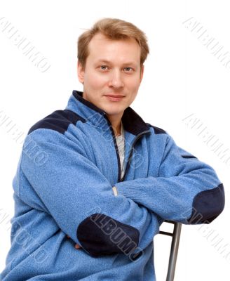 Portrait men blond sits on chair