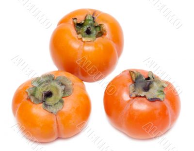Three ripe persimmons