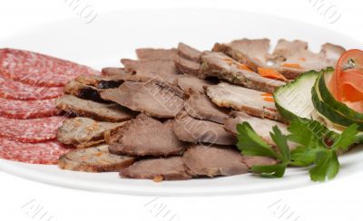 Smoked meat and sausage on plate