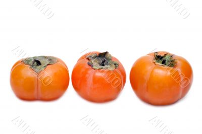 Three persimmons put in row