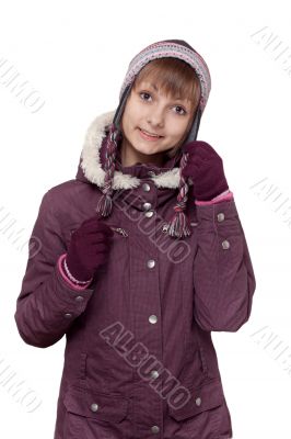 Girl in winter violet hooded jacket with hat