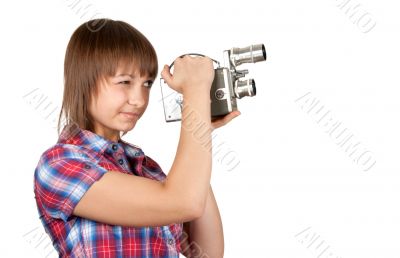 Girl in plaid shirt with movie camera
