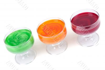 Green, yellow and red jelly in glass
