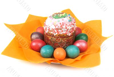 Easter pie in glaze and dyed egg on orange napkin