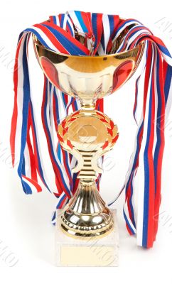 Golden cup, medals with tape