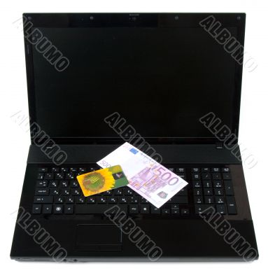 Yellow bank card rests upon keyboard