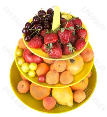Fruits in green vase insulated on white background