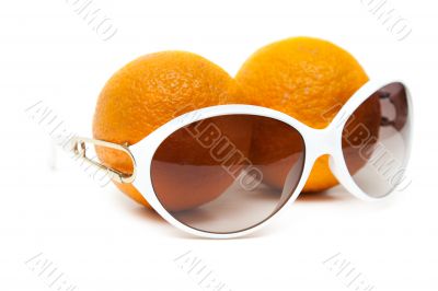 Sunglasses and two oranges