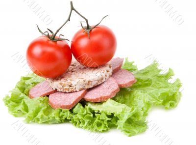 Sandwich with sausage, tomatoes and salad