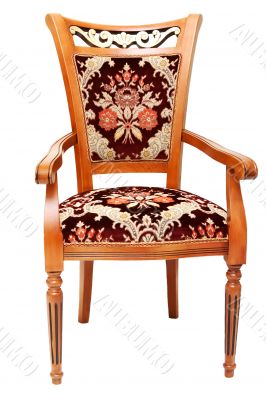 Beautiful wooden chair with expensive drapes