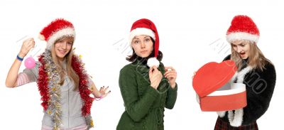 Three girls in cristmas hat with gift