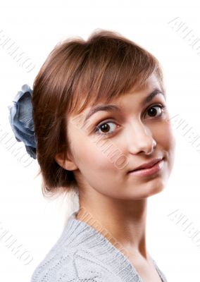 Portrait of the young girl in flower in hair