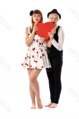 Two girls with red cardboard heart