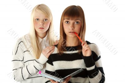 Two beautiful girls read diary book