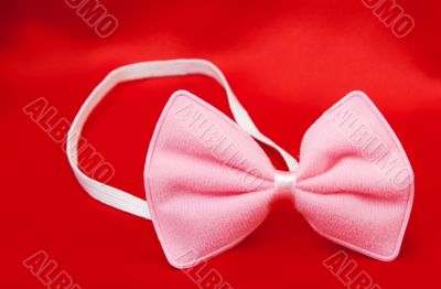 Pink butterfly on a tuxedo