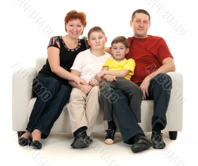 Family of four on a sofa