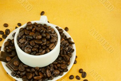 Cup full with coffee beans