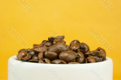 Cup full with coffee beans