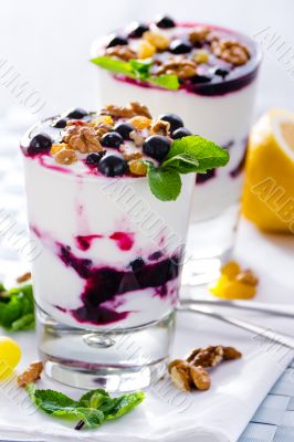 cream dessert with black currants