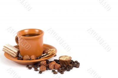 Cup of coffee with ingredients on a white background