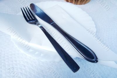 Cutlery over white plate