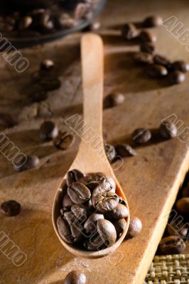 coffee beans in a wooden spoon