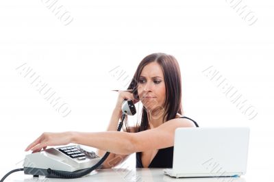 Secretary girl with an old phone and laptop