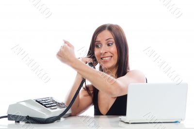 Secretary girl with an old phone and laptop