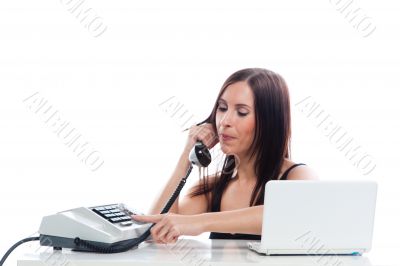 Secretary girl with an old phone and laptop