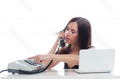 Secretary girl with an old phone and laptop